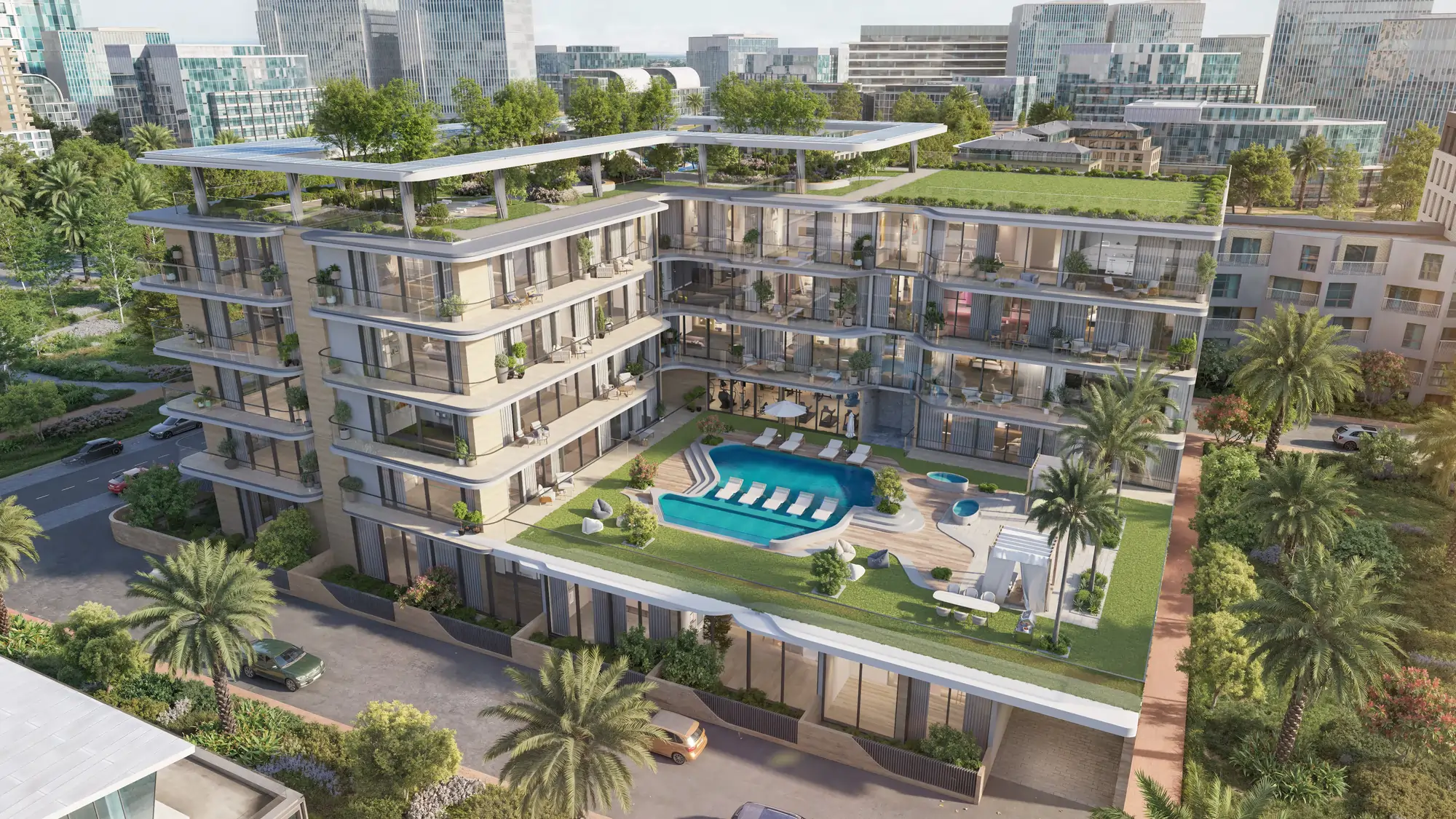 Aerial view of a modern multi-story residential complex with glass balconies, rooftop gardens, and a central outdoor pool area surrounded by lounge chairs and palm trees.