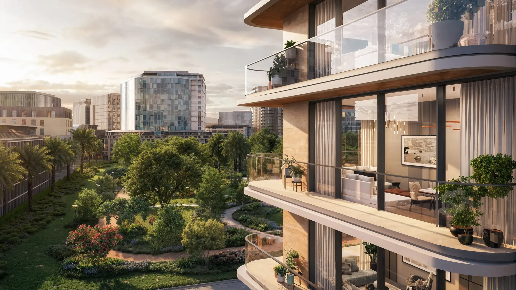 Modern glass-fronted apartment building with curved balconies overlooking a lush landscaped garden at sunset.