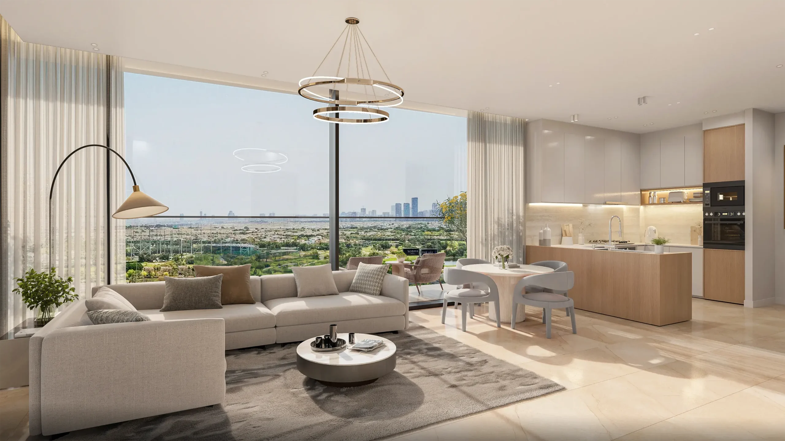 Open-plan living area with a beige sectional sofa, round coffee table, and a large window offering a city skyline view.